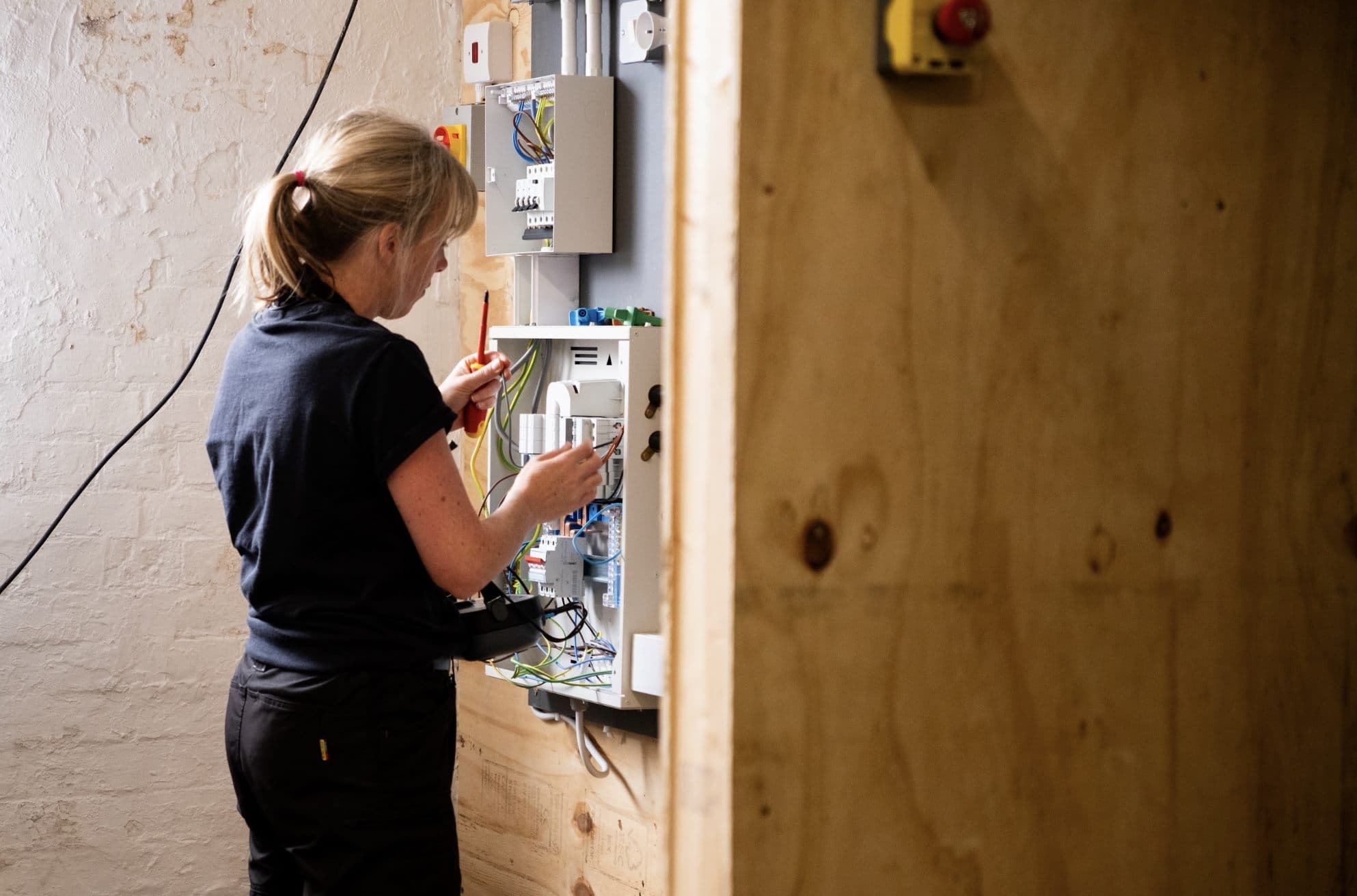 Self-employed electrician on site