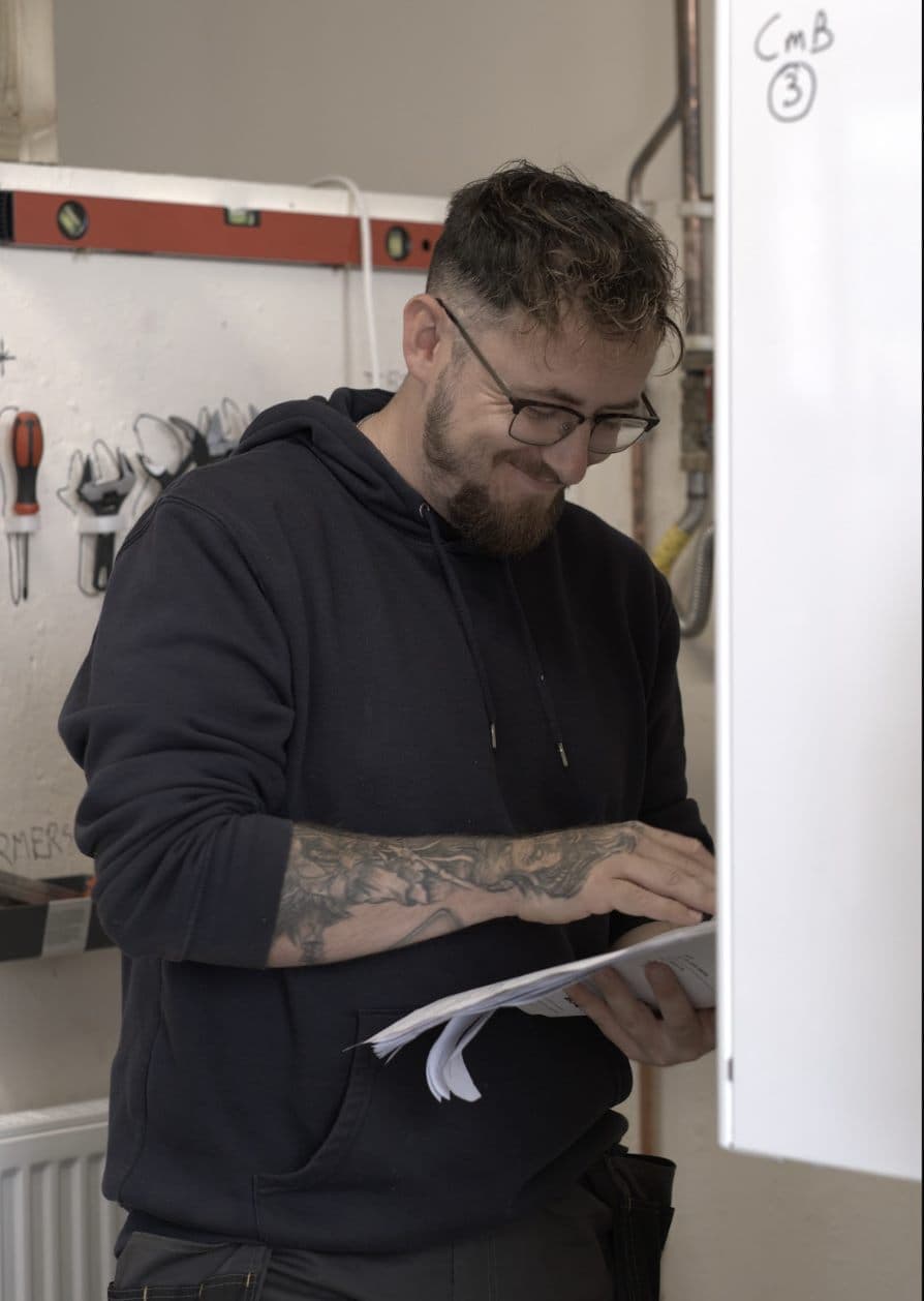 Gas engineer servicing a boiler